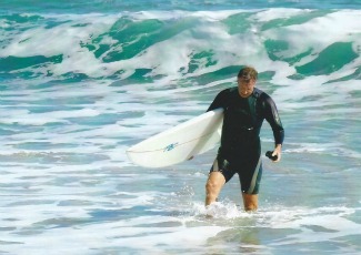 Thomas Locke heading to shore after surfing in Florida